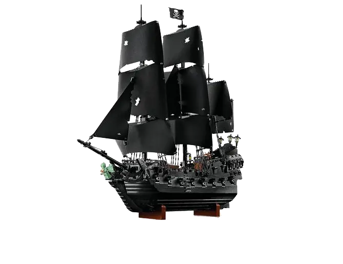 Un grand navire pirate noir avec des voiles déchirées et un drapeau à tête de mort flotte sur un support en bois.

Description générée par IA